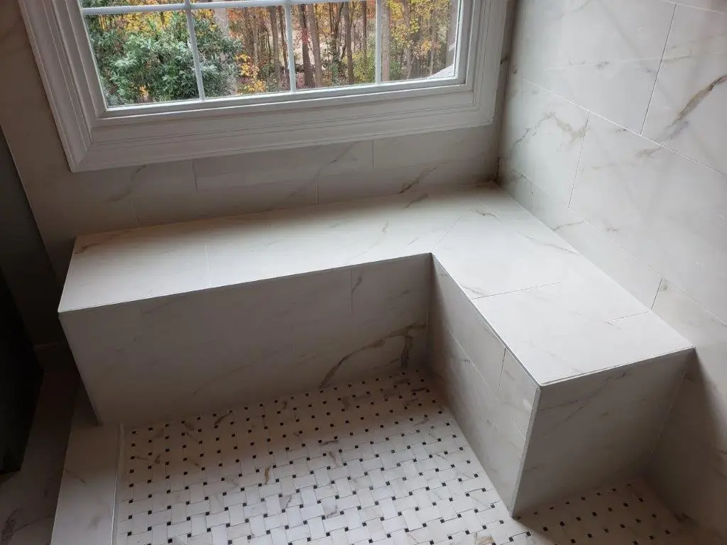 Tiled shower and vanity in a completed bathroom remodel