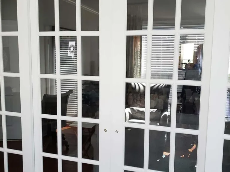 Completed French door installation with painted casing
